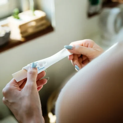 closeup-of-woman-hands-holding-pregnancy-test-2025-02-10-11-01-32-utc